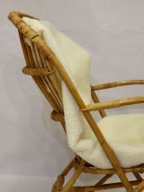 Fauteuil vintage en rotin année 60 pieds papillons.