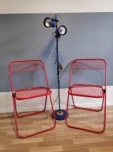 chaises pliantes rouges en métal crées par Talin en Italie
