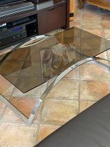 Table basse. Acier et verre fumé. 1970.