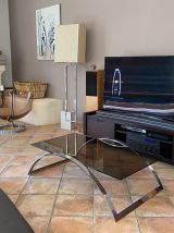 Table basse. Acier et verre fumé. 1970.