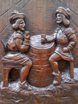 Ancien panneau en bois sculpté - Scène de taverne 
