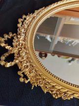 miroir Louis XVI en résine dorée à décor de noeuds