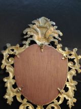 miroir rocaille en métal doré
