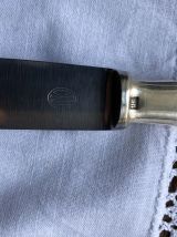 Série de 10 couteaux ERCUIS en métal argenté 