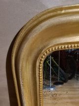 Miroir louis-philippe, début xxème. e à la feuille. En 