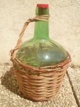 dame jeanne , bonbonne  avec osier