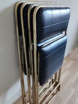 chaises pliantes noires et dorées vintage