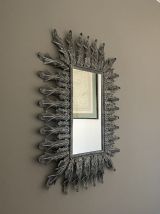 Grand miroir soleil en métal. 1960. 80x62.