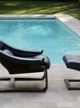 Fauteuil en cuir bleu  Kroken avec repose-pieds designe Ake 