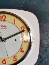 Horloge formica vintage pendule silencieuse Odo blanc orange