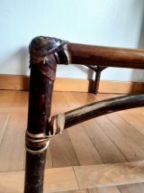 Grande table basse en rotin et verre fumé 1960 