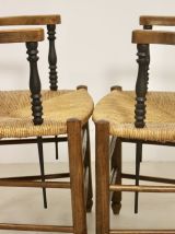 Paire de fauteuils en chêne massif et paille accoudoirs bico