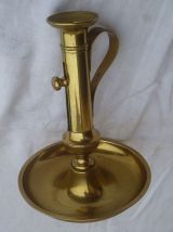 grand bougeoir poussoir en laiton , vintage