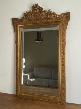 Miroir doré fin 19ème 140x88. Fronton décoré. 