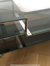 Table basse chrome et verre fumé