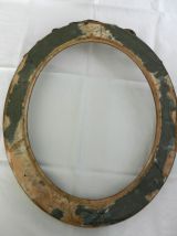 Grand cadre ovale en bois doré, nœud style Louis XVI