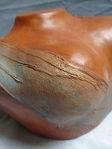 Petit buste drapé en terre cuite patinée