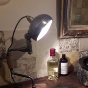 Lampe art récup avec  phare de moto et vilebrequin anciens