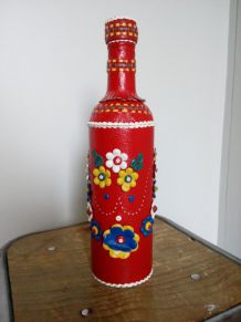 Grande bouteille, gourde, habillée de cuir très coloré, de l'ex-Yougoslavie