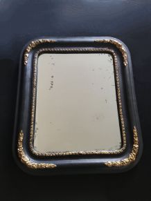 miroir ancien en bois noir et doré