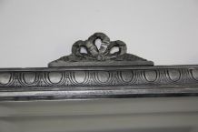 Miroir ancien en bois sculpté, patiné noir et argent