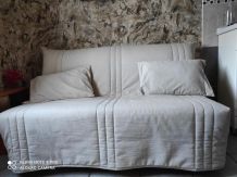 Canapé lit 2 places , couleur beige avec un tiroir de rangem