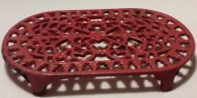 dessous de plat en fonte rouge