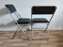 chaises pliantes noires et dorées vintage