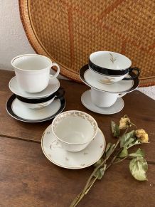 5 tasses dépareillées en blanc, noir et doré.