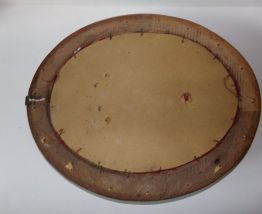 Médaillon en bois sculpté 