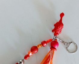 Porte clé dinosaure, bijou de sac, perles, pompon, rubans