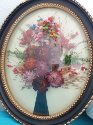 Cadre ovale bombe avec fleurs