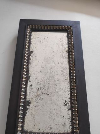 miroir long en bois marron et décor à feuilles dorées