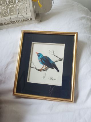Encadrement oiseau bleu en plumes