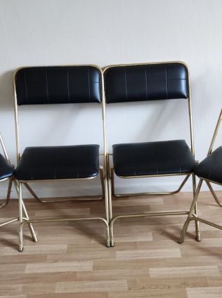chaises pliantes noires et dorées vintage
