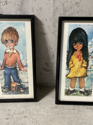 Paire de poulbots encadrés