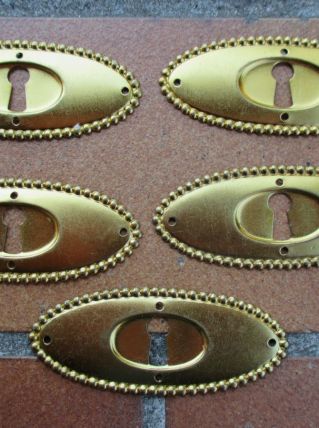 Entree de serrure ancienne ovale dorée pour meuble