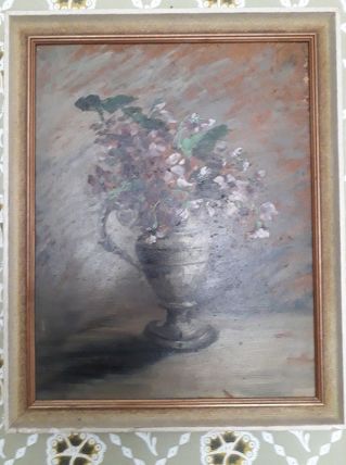 Tableau ancien à l'huile représentant un bouquet de fleurs.