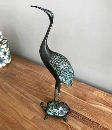 Bronze à patine verte.