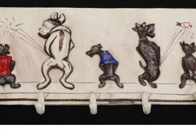 Magnifique porte manteau vintage en fonte avec 7 chiens